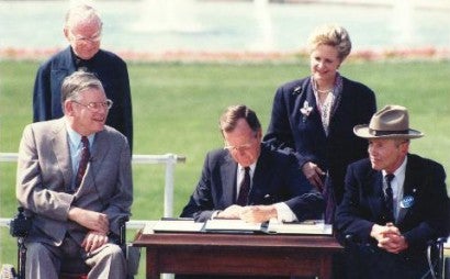 President Bush signing the ADA into Law